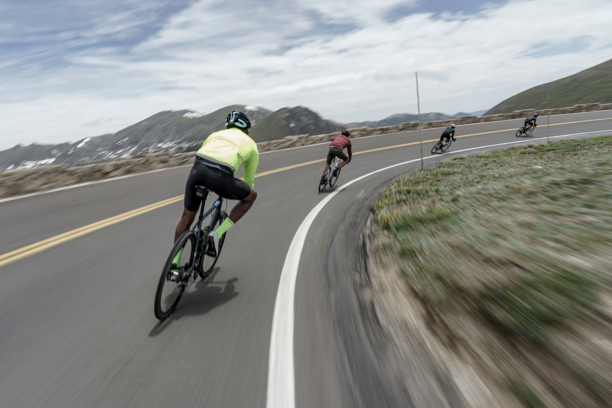 Riders taking a Corner On Road Bikes